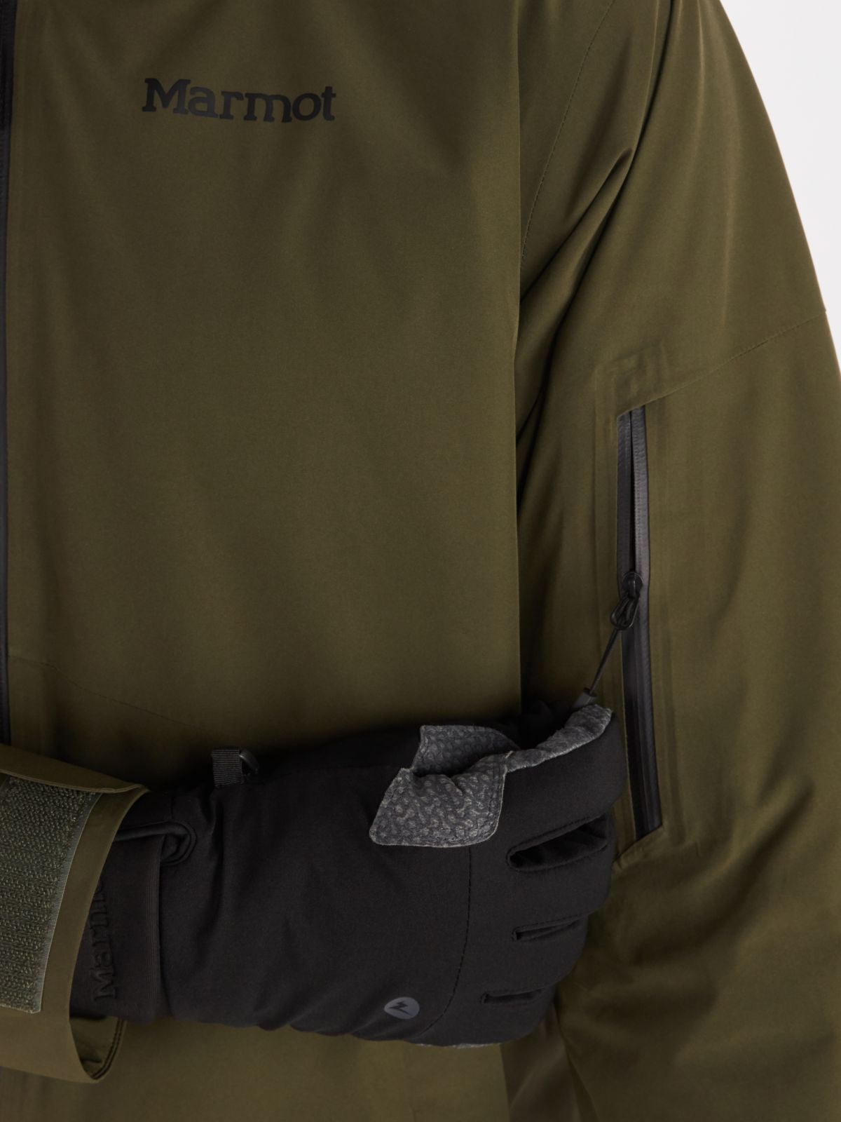 close up of zipper pocket on Marmot mens ski jacket in dark green