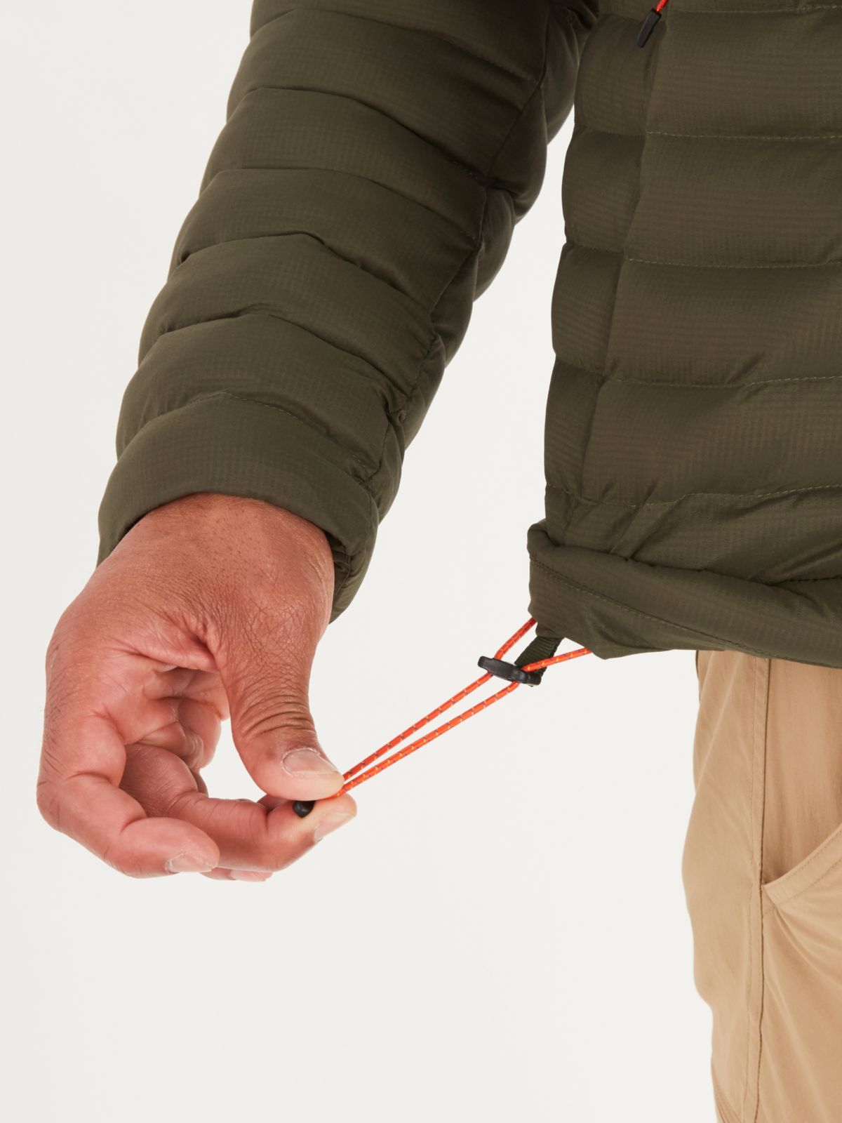 hand demonstrating draw string of down jacket