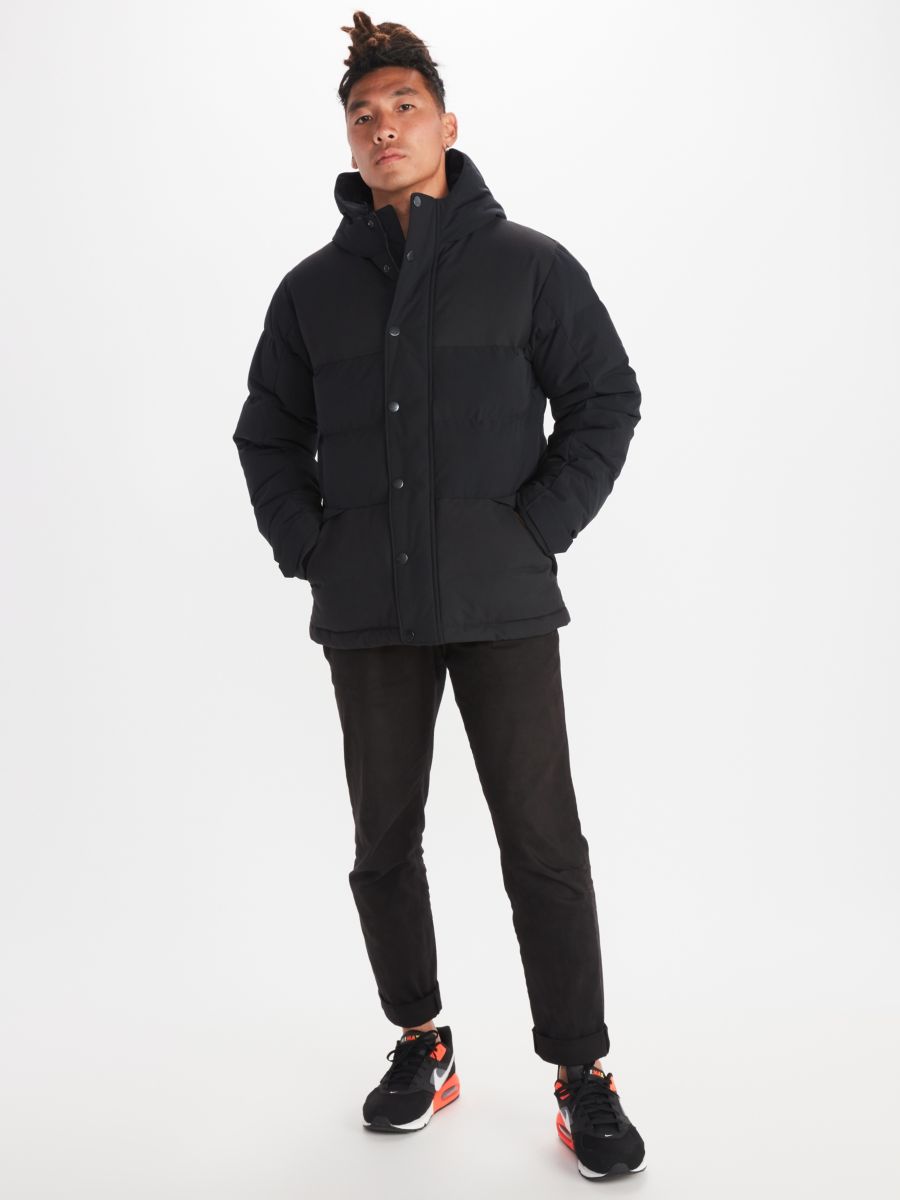 Man in black puffer coat with a hood