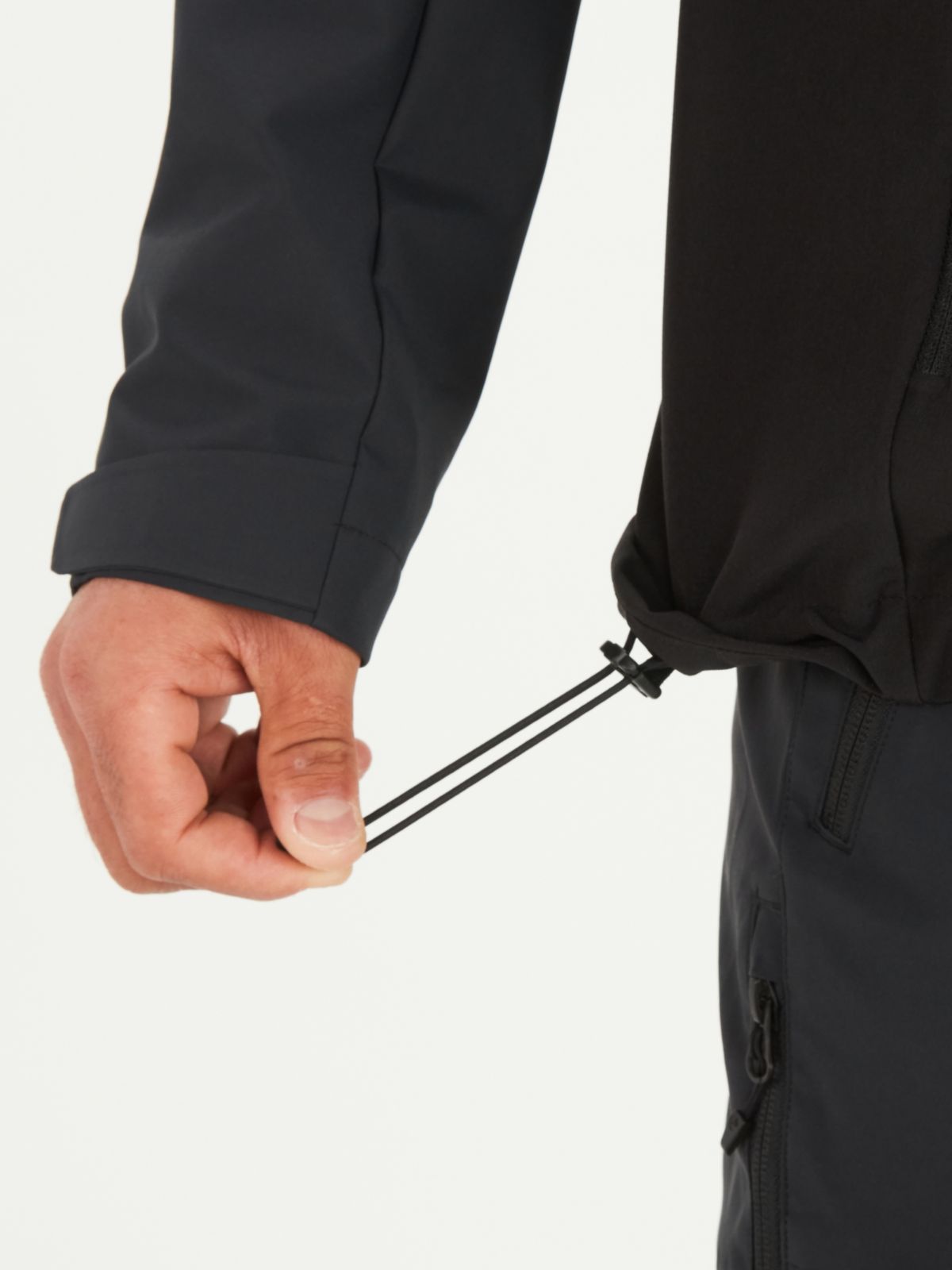 rain jacket tie at bottom to prevent wind from entering