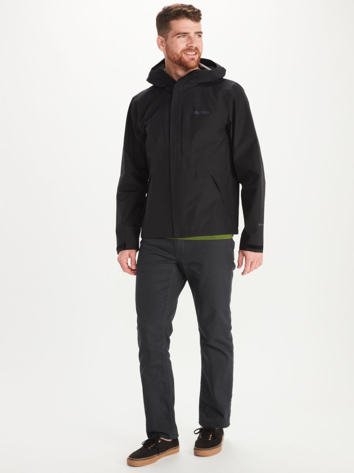 man modeling snowboard and ski jacket and pants