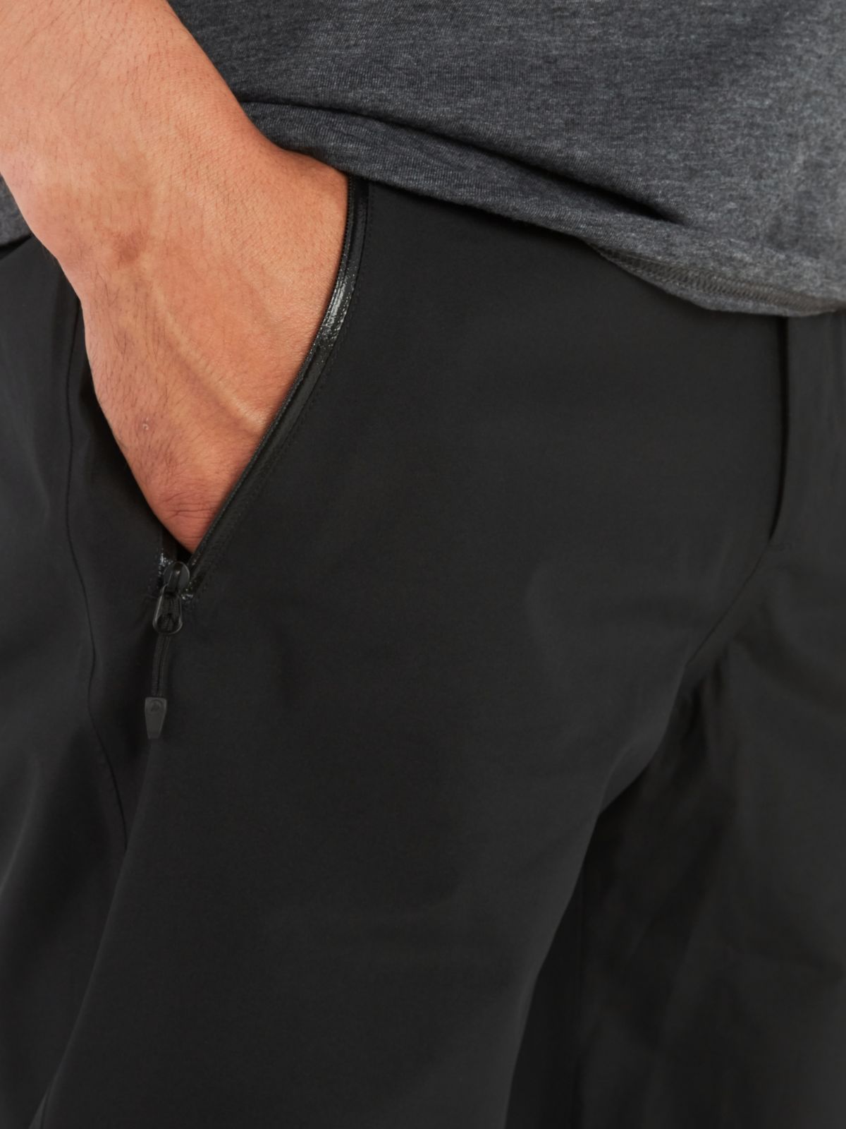 man with hand in pant's zipper pocket