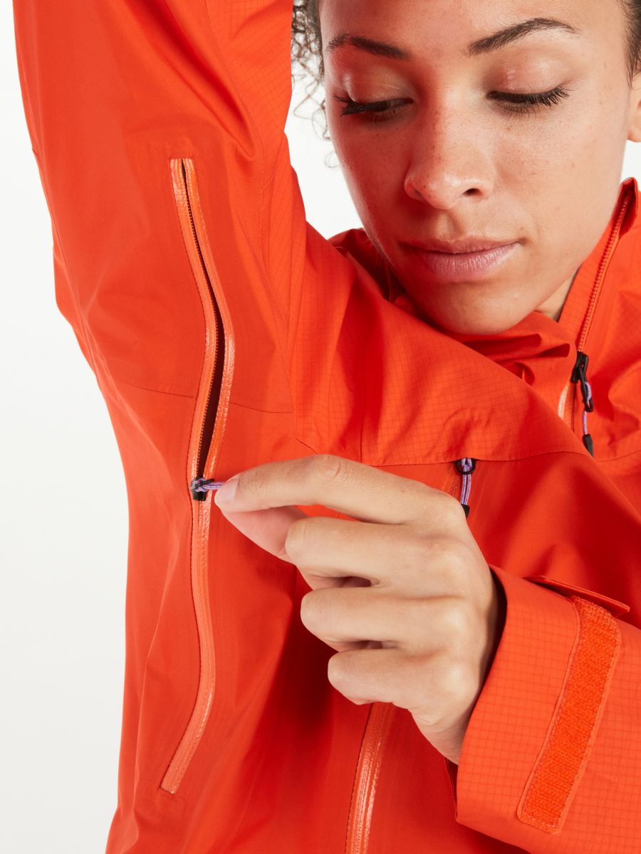 woman demonstrating zipper on rain jacket