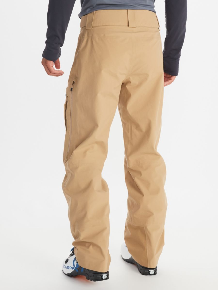 Model in Marmot men's hiking pant with zippered side pockets along thigh