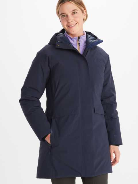 Model in Marmot women's full zip jacket with zippered side pocket in dark blue with attached hood