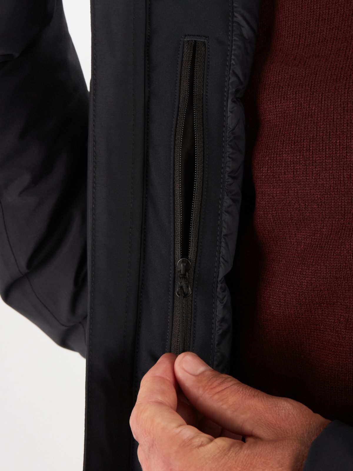 model pulling zipper on performance jacket
