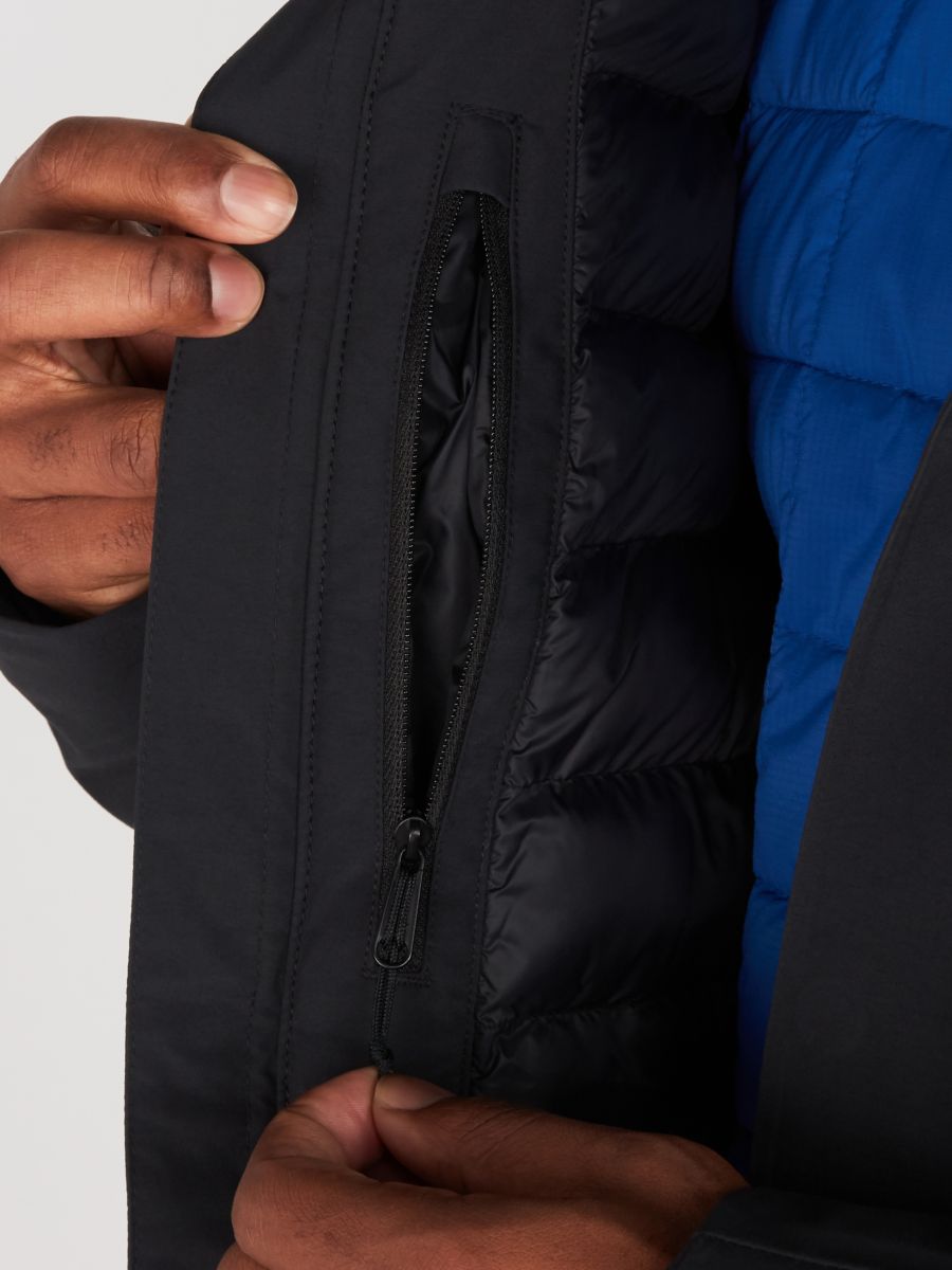 Man unzipping interior coat pocket