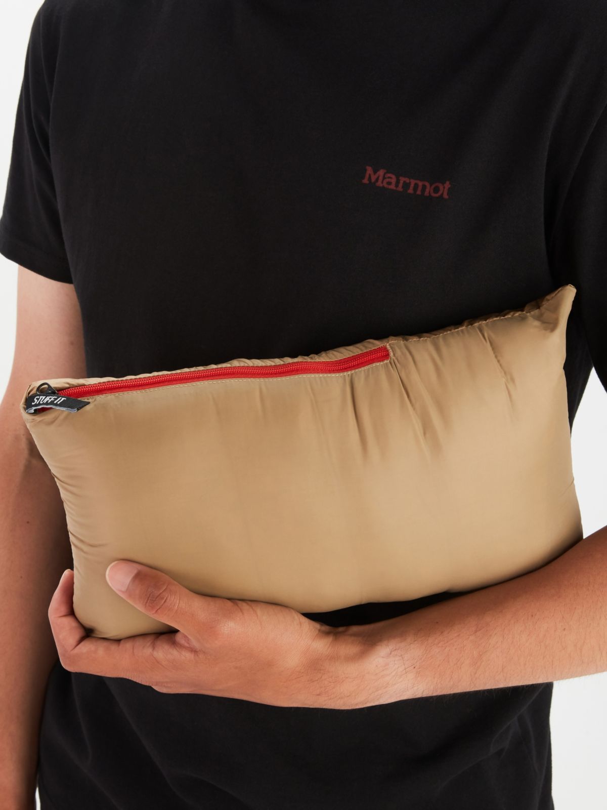 model in t shirt holding a portable pouch
