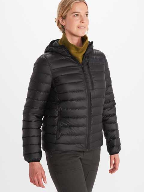Model wearing Marmot women's insulated full zip quilted jacket in black with zippered chest pocket