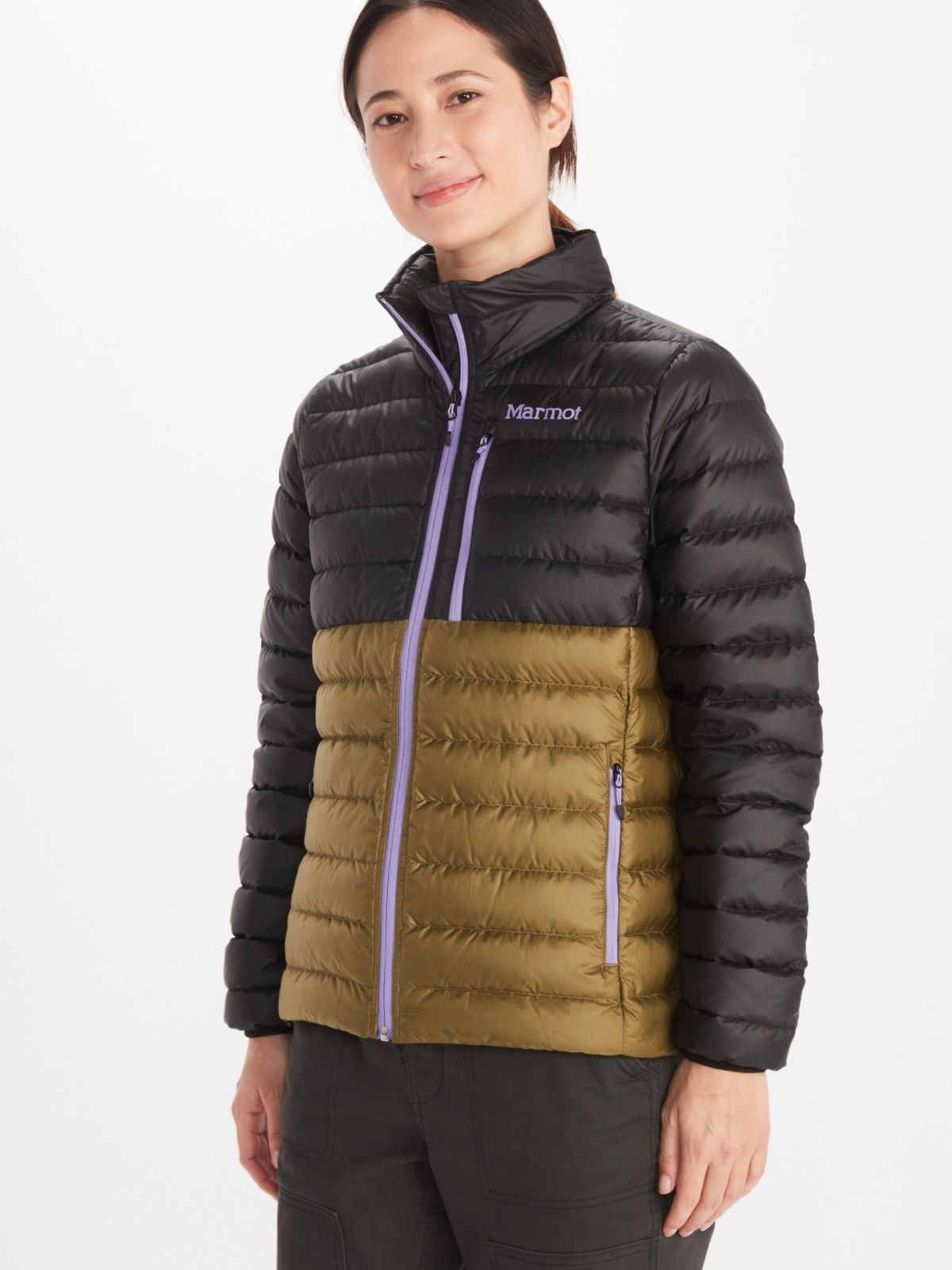 Model wearing Marmot women's insulated jacket in black and gold with full zip accented in lilac