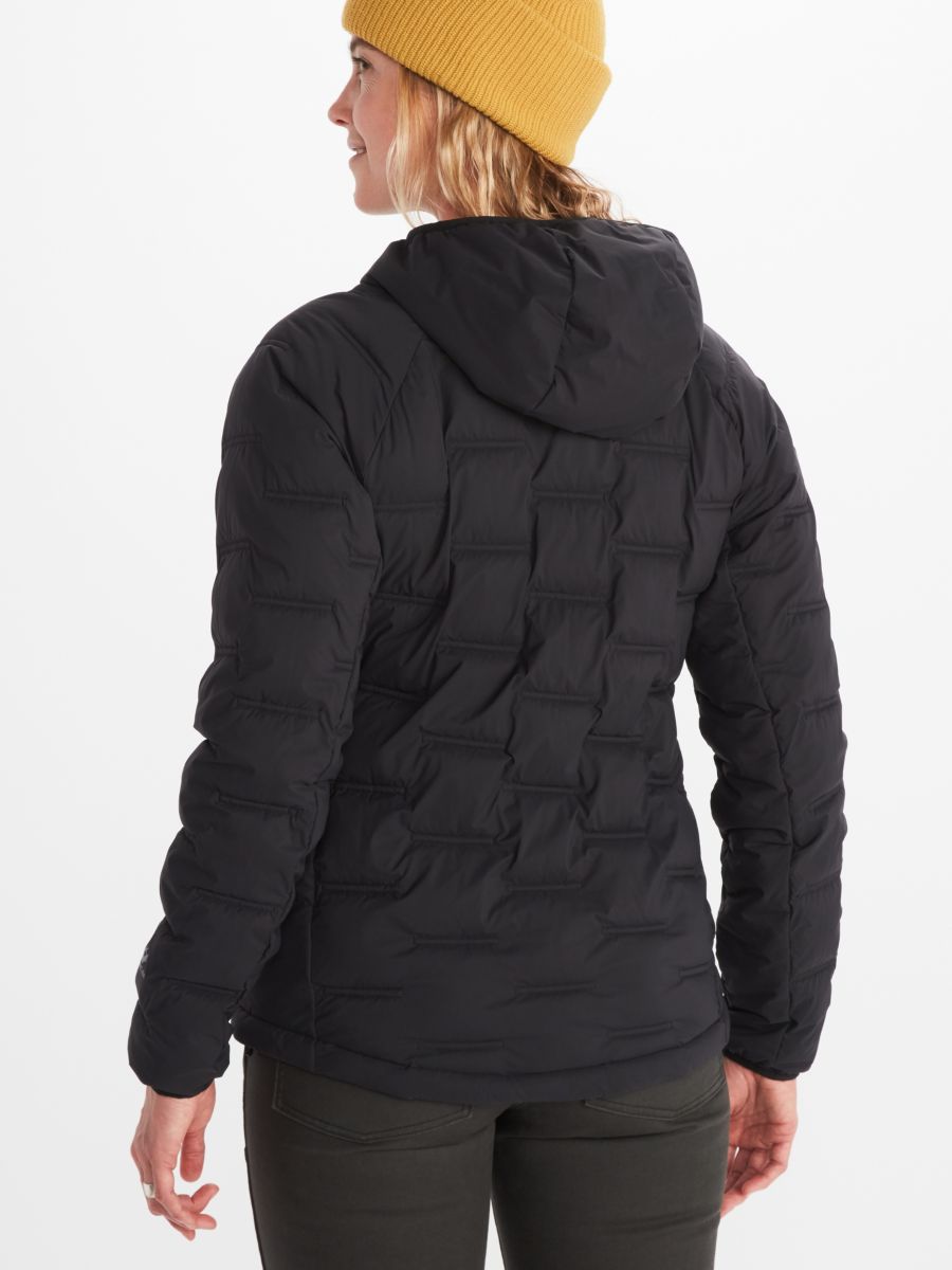 Model wearing Marmot women's insulated jacket in black with hood
