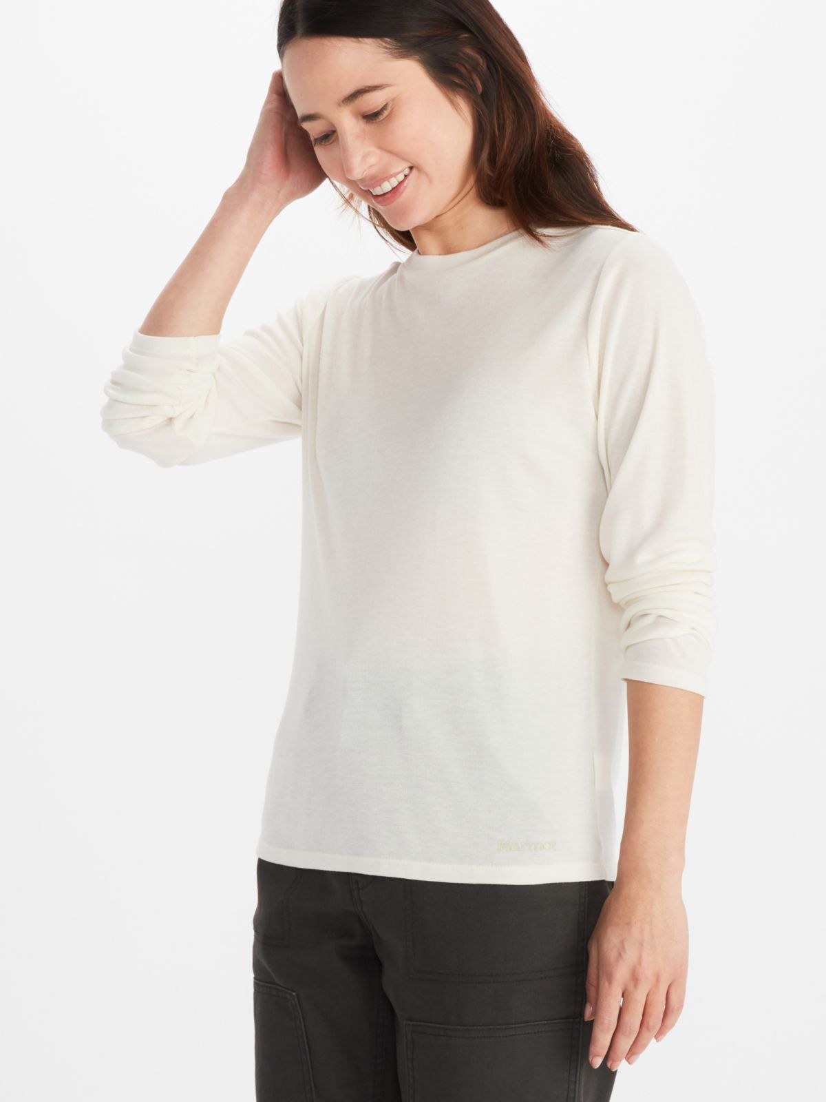 Model wearing Marmot women's long sleeve sweatshirt in off-white