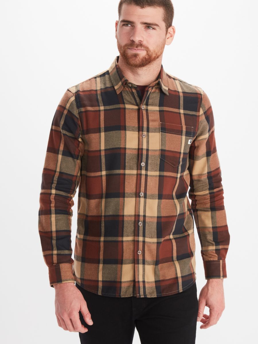 Model wearing Marmot men's long sleeve button front flannel shirt in brown and tan plaid