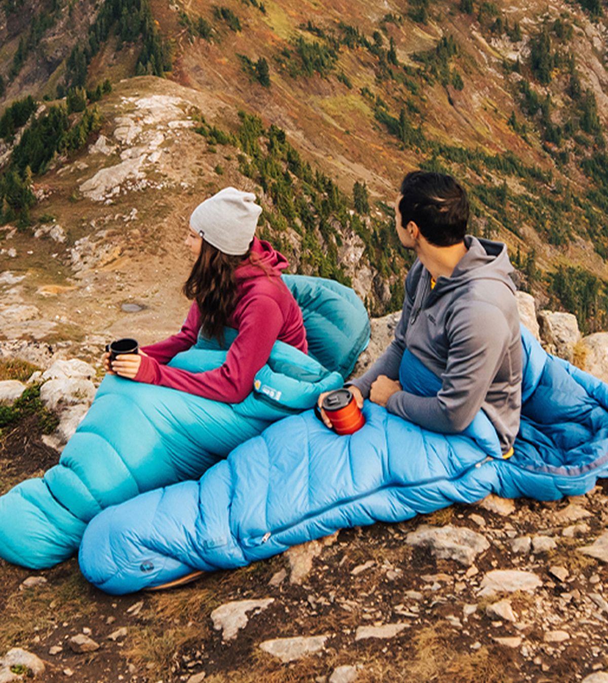 couple camping on mountainside